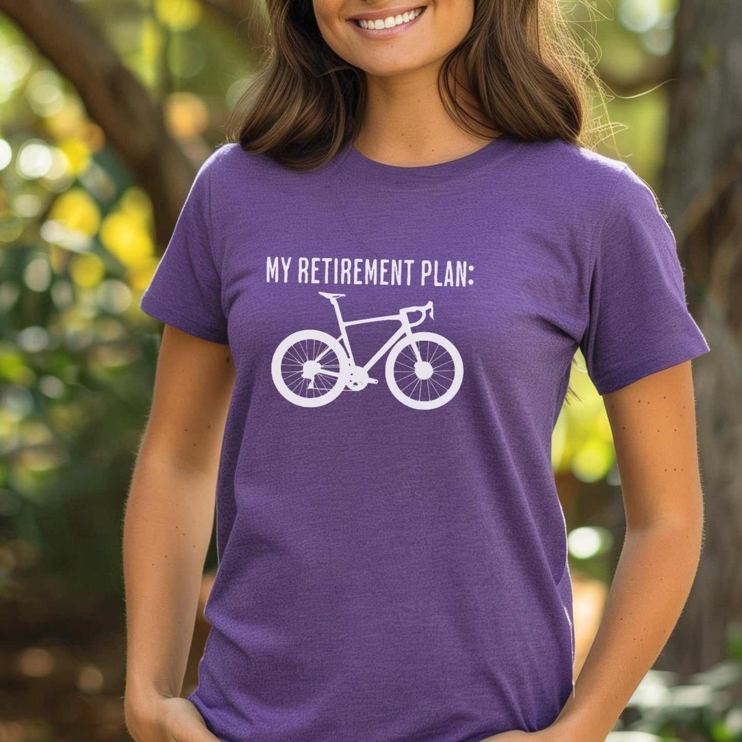 Woman wearing a purple t-shirt with a bicycle graphic and text, standing outdoors.