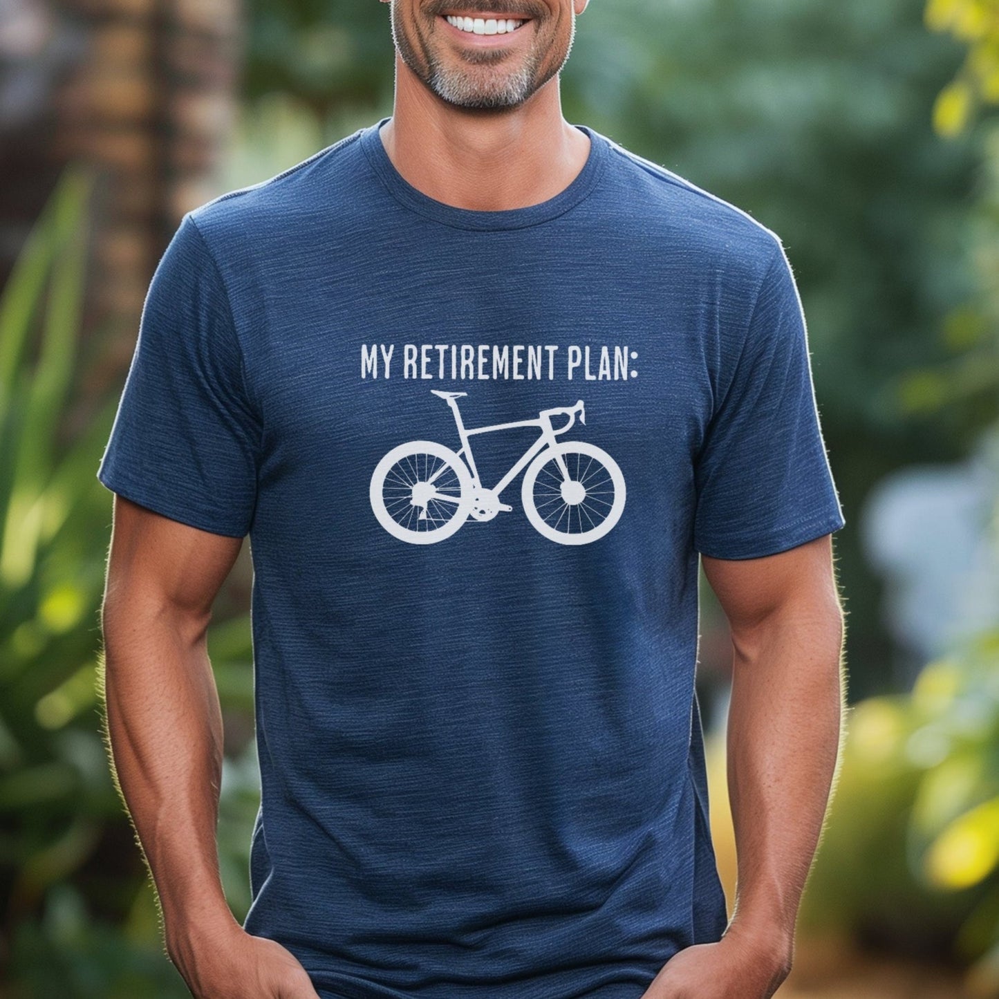 Man wearing a blue t-shirt with a bicycle graphic and text, standing outdoors.
