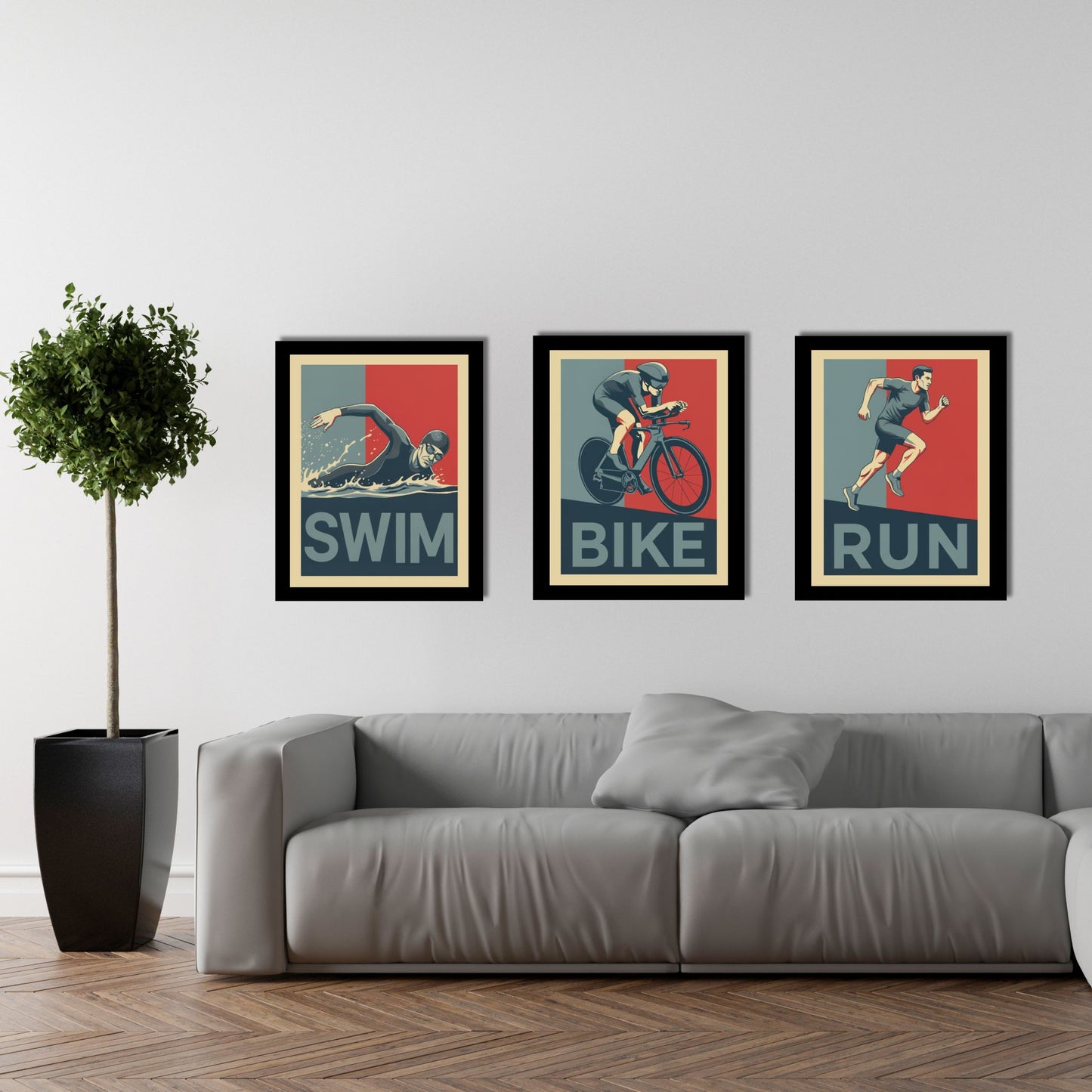 Three framed posters of a swimmer, cyclist, and runner on a wall above a sofa.