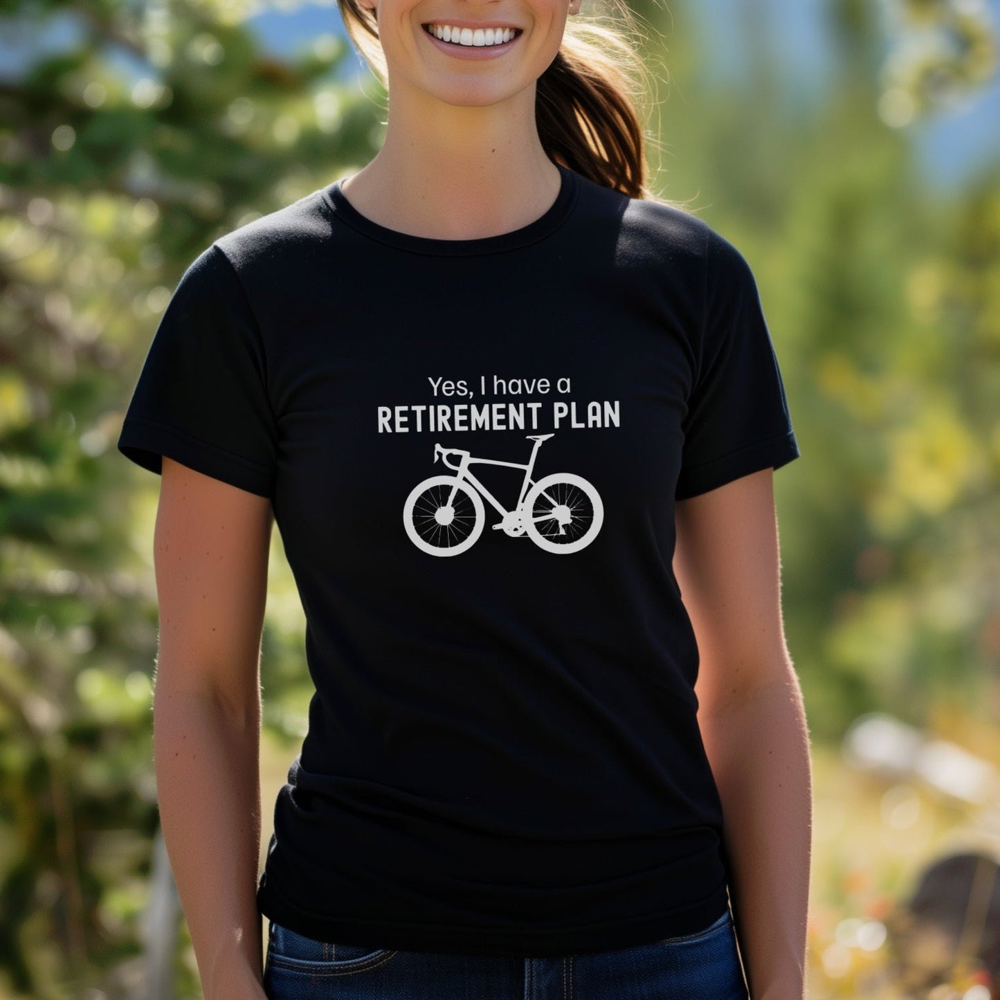Person wearing a black t-shirt with a bicycle graphic and text in an outdoor setting