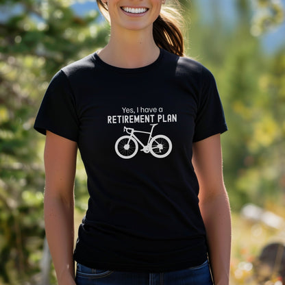 Person wearing a black t-shirt with a bicycle graphic and text in an outdoor setting