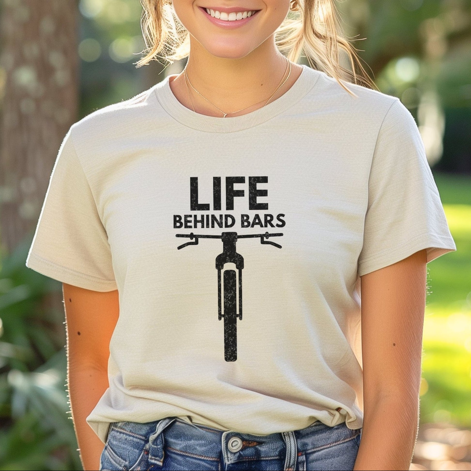 Person wearing a t-shirt with 'Life Behind Bars' graphic and text.