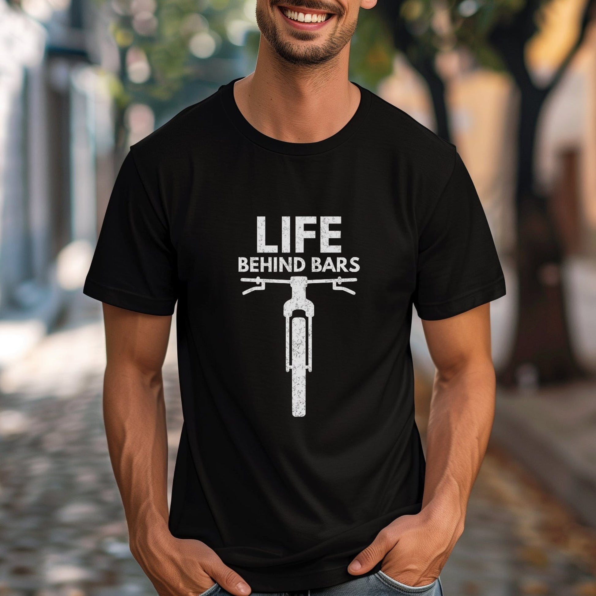 Man wearing a black t-shirt with 'Life Behind Bars' graphic on a street.