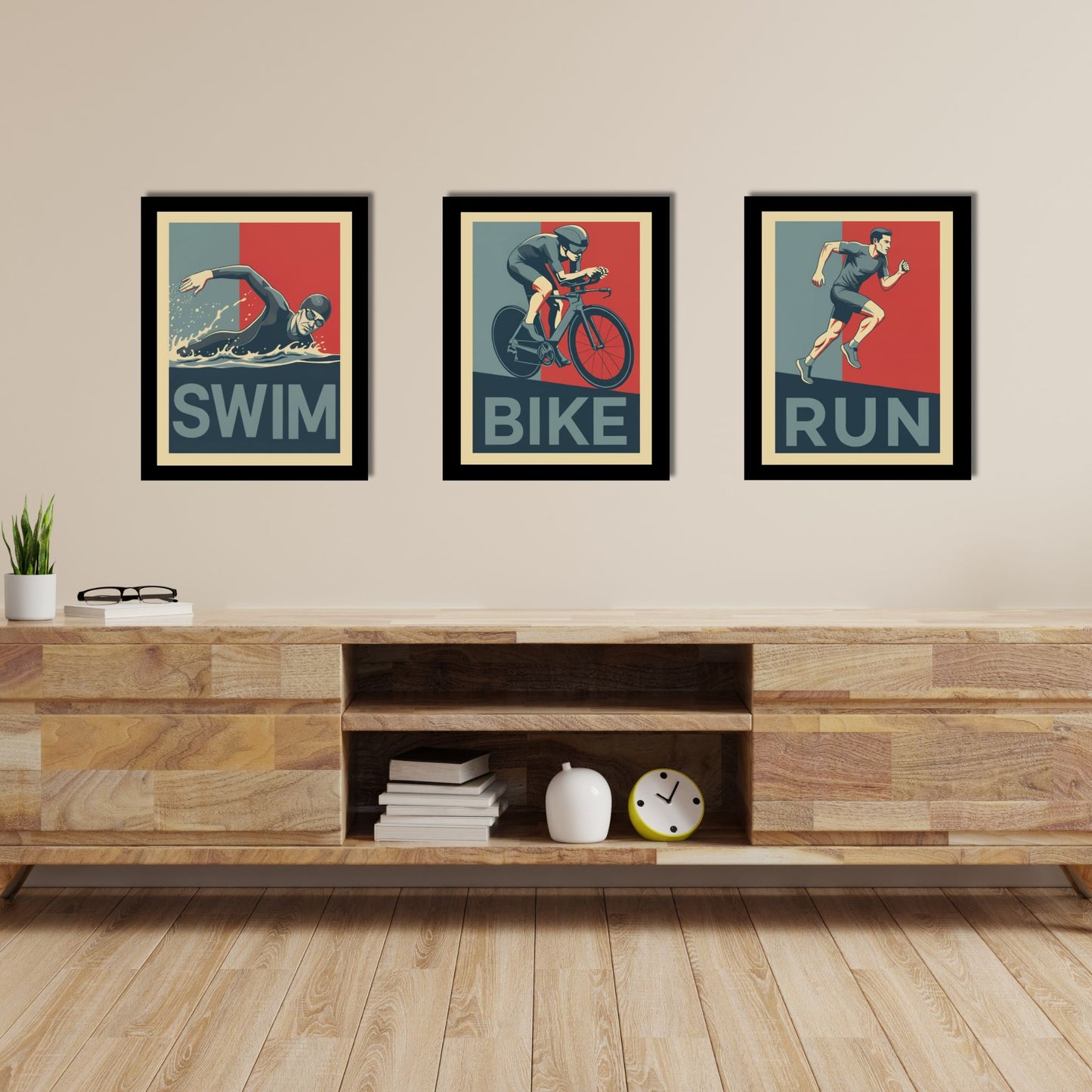 Three framed posters labeled 'Swim', 'Bike', and 'Run' above a wooden entertainment console.